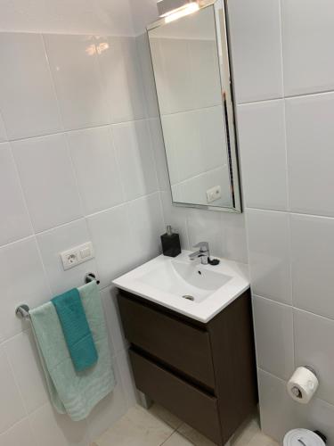 a bathroom with a sink and a mirror at Dream Ravine in Santa Cruz de Tenerife