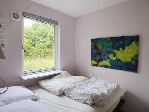 Posteľ alebo postele v izbe v ubytovaní Two-Bedroom Holiday home in Jægerspris 1