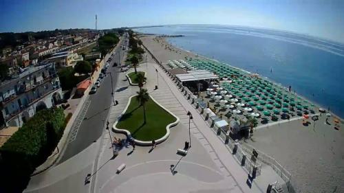 an aerial view of a beach with umbrellas at Hotel Mediterraneo in Roccella Ionica