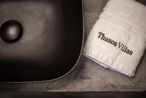 a close up of a napkin next to a knife at SunBlue Boutique Villas in Skala Rachoniou