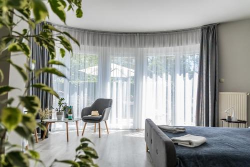 En eller flere senge i et værelse på Villa 21 Boutique Rooms