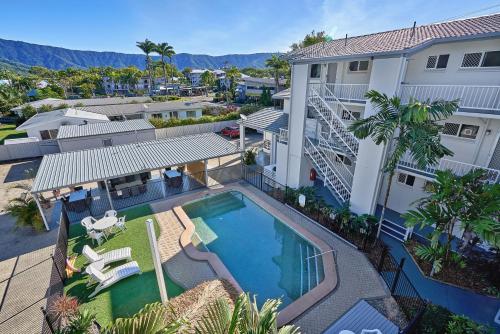 an aerial view of a house with a swimming pool at Cocos Holiday Apartments in Trinity Beach