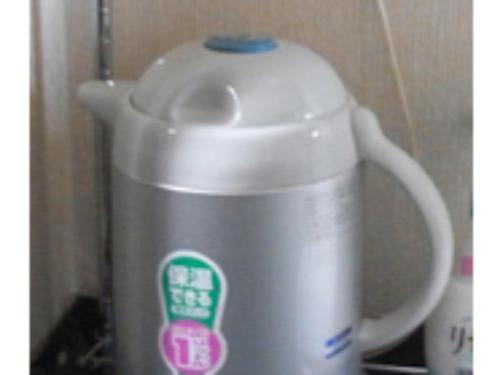 a white tea kettle sitting on top of a stove at Business Hotel Heisei - Vacation STAY 90551 in Yonezawa