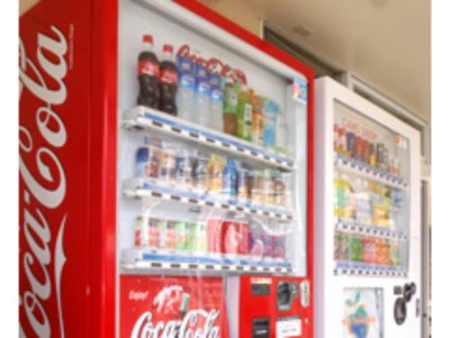 a coca cola refrigerator filled with lots of soda at Business Hotel Heisei - Vacation STAY 90553 in Yonezawa