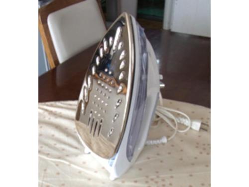 a iron sitting on top of a chair at Business Hotel Heisei - Vacation STAY 90553 in Yonezawa