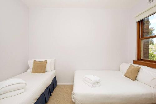 Ein Bett oder Betten in einem Zimmer der Unterkunft HIGH5NS - Haven on High