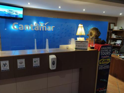 a counter with a canadian sign in a store at Club Cantamar Beach Hotel & Marina in La Paz