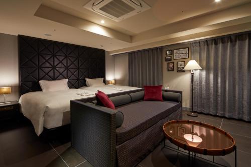 Säng eller sängar i ett rum på Centurion Hotel&Spa Vintage Kobe