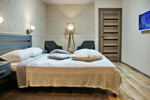 Säng eller sängar i ett rum på Molex Apartments 3
