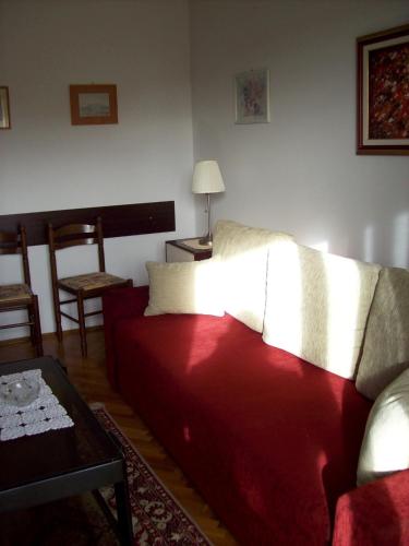 a living room with a couch and a table at Apartment Degobbis in Rovinj