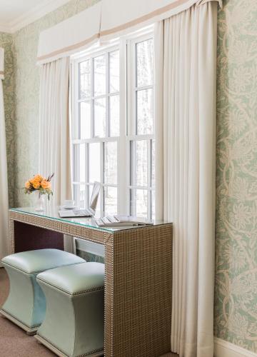 a desk in a room with a window at The Inn at Hastings Park, Relais & Châteaux in Lexington