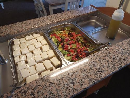 a tray of food on a counter with a tray of food at Na Losenici in Nicov