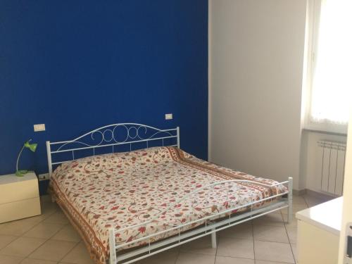 Ліжко або ліжка в номері A Casa di Nonna Luciana - Trilocale con Giardino