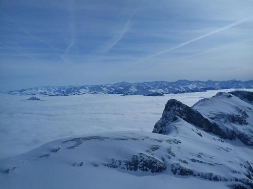 a mountain covered in snow with mountains in the background at Ferienwohnung Schautzgy in Reutte