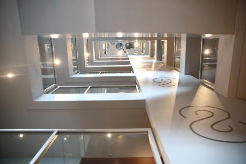 a view of a hallway in a building at Van der Valk Hotel Amsterdam Zuidas -Rai in Amsterdam