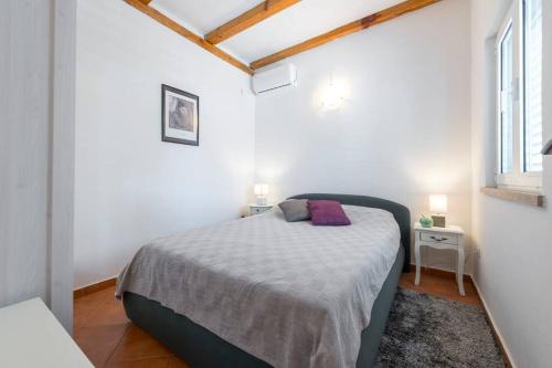 Postel nebo postele na pokoji v ubytování Villa Lora