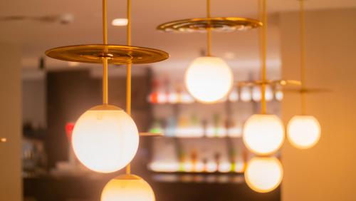 a bunch of lights hanging from a ceiling at Isla Mallorca & Spa in Palma de Mallorca