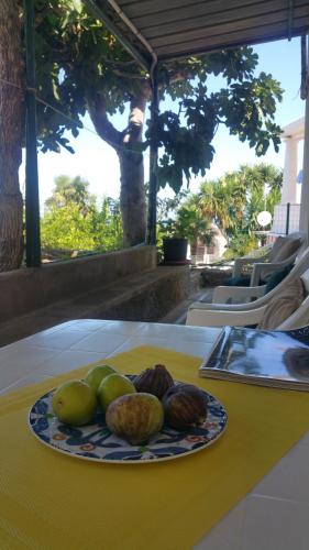 a plate of fruit on top of a table at Villa dei fiori B&B in Capri