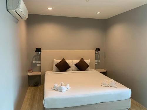 Ένα ή περισσότερα κρεβάτια σε δωμάτιο στο Behind The Scene Hotel Club @ Samui