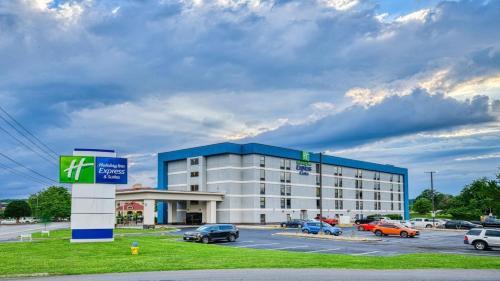 a large building with cars parked in a parking lot at Holiday Inn Express Hotel & Suites Pigeon Forge by IHG in Pigeon Forge