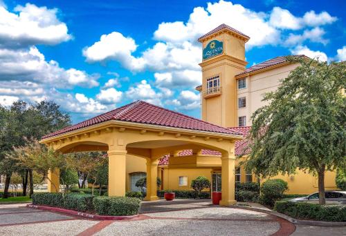 a building with a clock tower on top of it at La Quinta by Wyndham Dallas North Central in Dallas