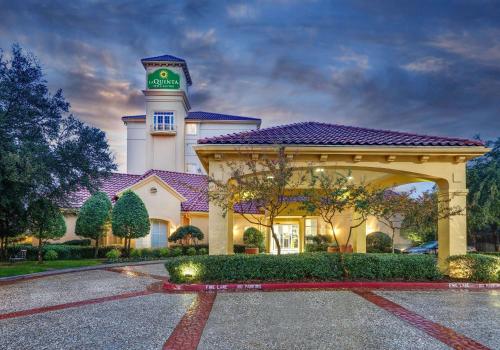 a building with a clock tower on top of it at La Quinta by Wyndham Dallas North Central in Dallas