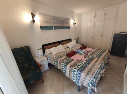 a bedroom with a bed with a quilt on it at Novelty I in Salou
