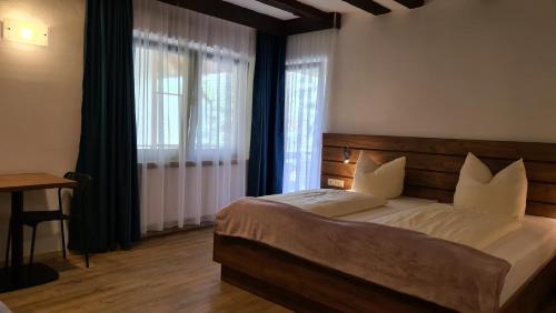 
Ein Bett oder Betten in einem Zimmer der Unterkunft Hotel Reiterhof-Altmühlsee
