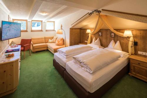 Ένα ή περισσότερα κρεβάτια σε δωμάτιο στο Hotel Ilga