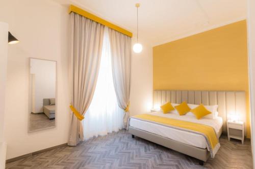 Posteľ alebo postele v izbe v ubytovaní Frattina FF italian suites