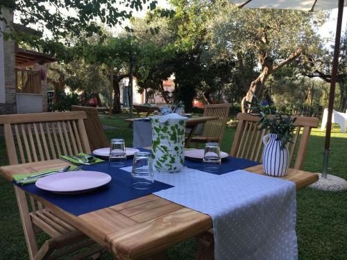 a wooden table with a blue table cloth on it at Az. Agr. Parco dei Buoi in Larino