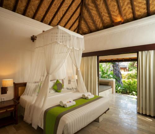 Кровать или кровати в номере Mimpi Resort Tulamben