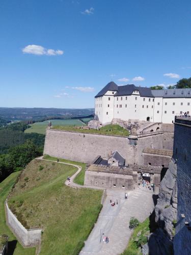 a large castle on top of a hill at Landpension Haupt in Sebnitz