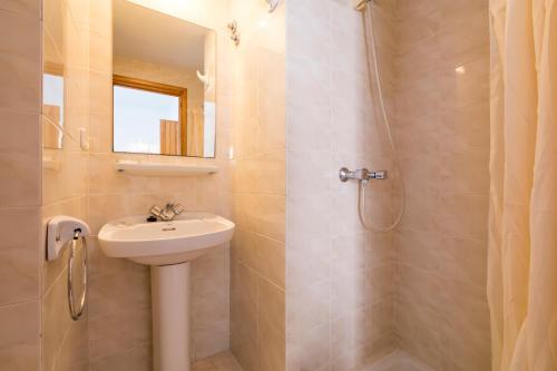 a bathroom with a sink and a shower at Hostal Ferrer in San Antonio