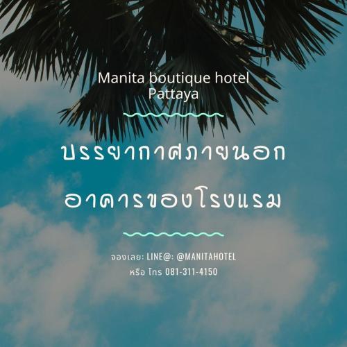 Certificado, premio, señal o documento que está expuesto en Manita Boutique Hotel