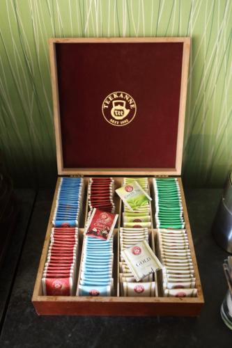 a wooden box filled with different types of ties at Hotel Skicentrum in Harrachov