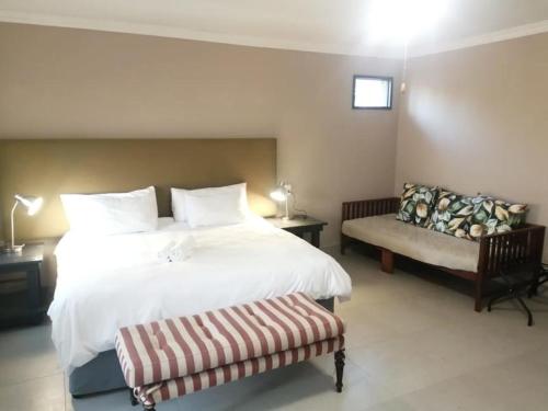 Ένα ή περισσότερα κρεβάτια σε δωμάτιο στο Zebrina Guest House