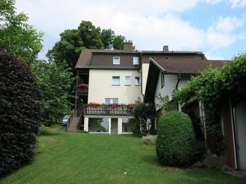 a house with a large yard in front of it at Gästehaus Frankenhof in Bad Steben