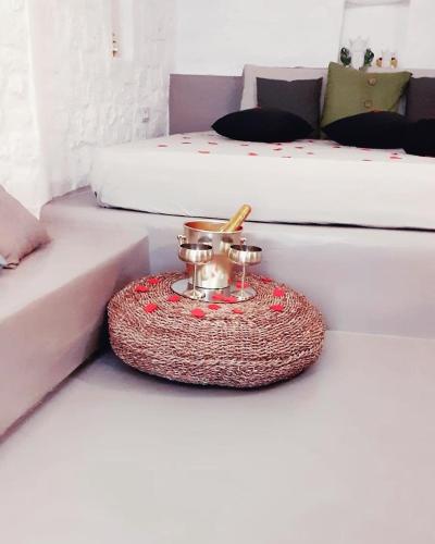 a bed room with two beds and a table with a phone at Il Fico Deluxe in Ostuni