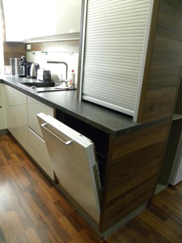 a kitchen with a counter with a sink and a window at Apartment WELLNESS Vlčková in Vlčková