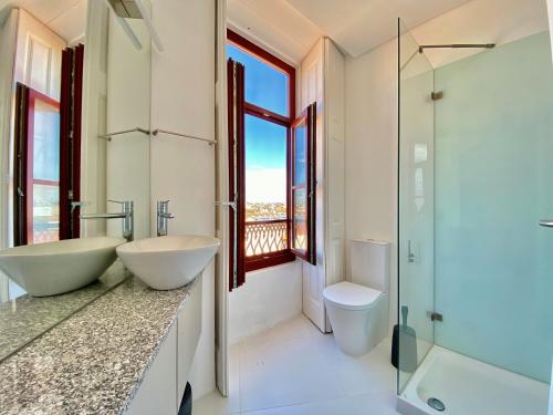 a bathroom with two sinks and a shower at Porto.Leça - Studios and Apts (Apt D) in Leça da Palmeira