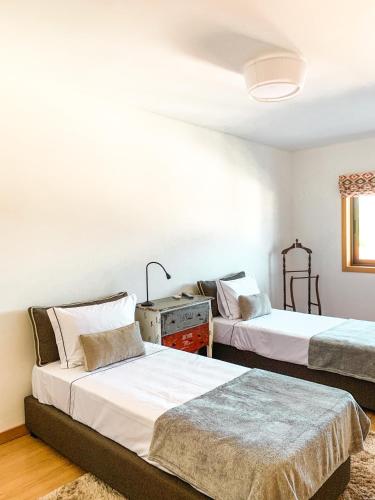 Ένα ή περισσότερα κρεβάτια σε δωμάτιο στο Quinta das Cerdeiras