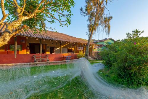 a water fountain in the yard of a house at Pousada da Rosa in Ilhabela