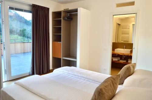 Postel nebo postele na pokoji v ubytování Agriturismo Terre di Ginepro