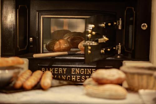 a toaster oven with bread and loaves of bread at Hyatt Regency Mexico City in Mexico City