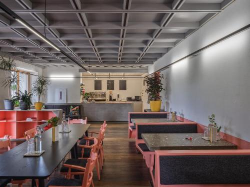 a restaurant with tables and chairs and a counter at Ferien Seminar Retreat - Zugspitze in Leutasch