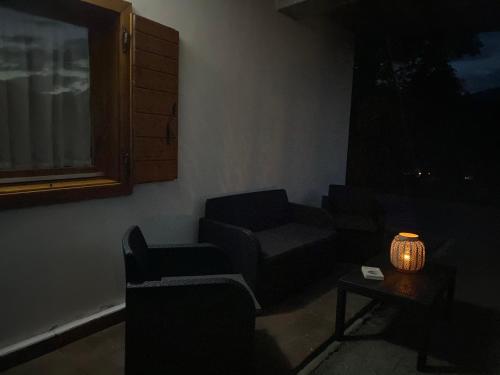 a living room with a couch and a table at Casa Belvedere in Pieve di Cadore