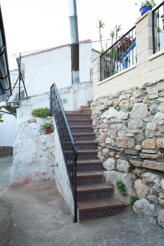 a set of stairs next to a stone wall at Vistas de Chamberi in Alhama de Aragón