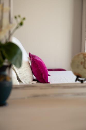 a purple flower sitting on top of a pillow at Vistas de Chamberi in Alhama de Aragón