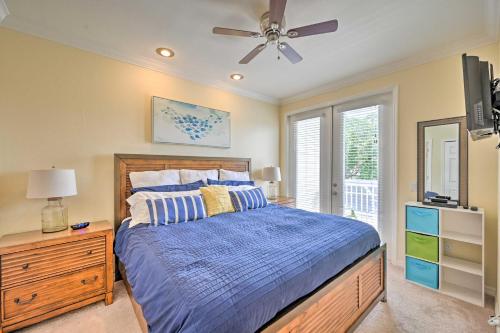 a bedroom with a bed and a ceiling fan at Pool and Boat Dock! Waterfront Cape Coral Townhome in Cape Coral